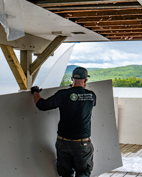 Eco Haven technician beside branded pest control truck